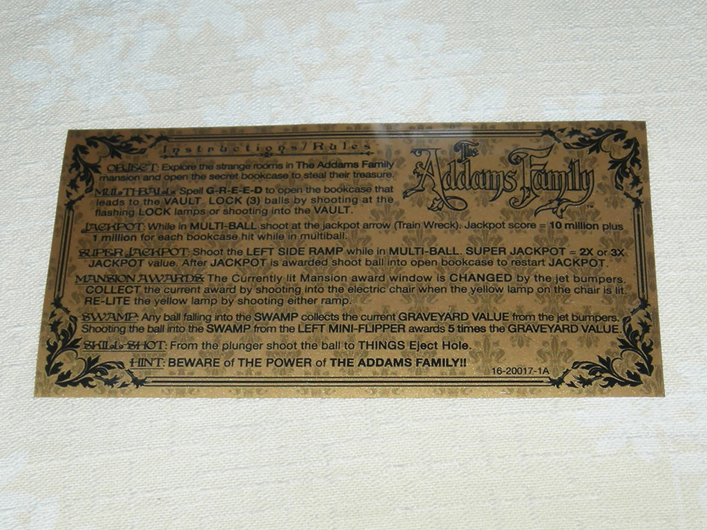 "The Addams Family Custom Pinball Cards" (BALLY) printed in gold vinyl